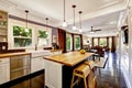 Home interior in white tones with black hardwood floor and white coffered ceiling.. Royalty Free Stock Photo