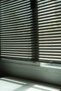 home interior window with vertical blinds shows a mix of dirty and clean surfaces, reflecting decoration design challenges Royalty Free Stock Photo