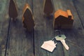 Home key with house keychain and wooden tree and home mockup on vintage wood background, property concept Royalty Free Stock Photo