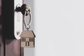 The home key with house keyring in the door keyhole with copy space Royalty Free Stock Photo