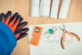 Home keys with electrical drawings, protective blue helmet with gloves and orange work tools, concept of building home Royalty Free Stock Photo