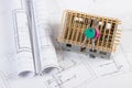 Home keys, small house under construction and electrical drawings, building home concept Royalty Free Stock Photo