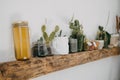 Home kitchen rustic interior decor of apartment with table, clay and wooden utensil, flowers, home plants, textile. Stylish home