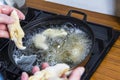 Home kitchen. On the stove of the pan in it, hot oil is thrown into it for frying Royalty Free Stock Photo