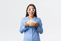 Home leisure, sleepover and slumber party concept. Enthusiastic asian girl in pajamas and 3d glasses, holding bowl of Royalty Free Stock Photo