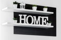 Home letters decor on white shelf