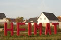 Home Letters in front of Houses