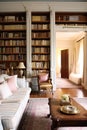 Home library decor, sitting room and interior design, white living room with sofa, bookcase and bookshelves in English country Royalty Free Stock Photo