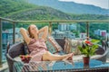 Home lifestyle woman relaxing sleeping on sofa on outdoor patio living room. Happy lady lying down on comfortable Royalty Free Stock Photo