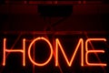 HOME lit neon sign, close-up lights, full frame background Royalty Free Stock Photo