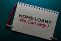 Home Loan? We Can Help! write on a Book isolated on Office Desk