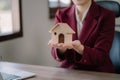 home loan officer gives the house keys to the client after signing a real estate contract with an approved mortgage application Royalty Free Stock Photo