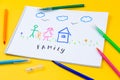 Home, love, family, still life concept. felt-tip pen lying on a paper with children`s drawing family. Selective focus, copy space