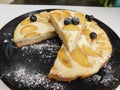 Home made apple cake in the black plate served on table Royalty Free Stock Photo