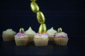 Easter cakes with golden eggs in a vertical line for creative decorations Royalty Free Stock Photo