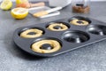 Home made baking concept, donut dough, donuts, eggs, lemon, kitchen utensils Royalty Free Stock Photo
