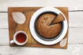 Home made banana cake with cup of tea on white background. Cake as a Pack man (old fashioned computer game) Royalty Free Stock Photo