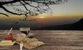 Home made bread on butcher and black coffee in clear glass for breakfast concept on wooden table. Background blur mountian
