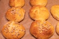 Home made bread rolls or buns for breakfast fresh on a paper on a table, selected focus, narrow depth of field Royalty Free Stock Photo