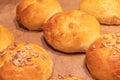 Home made bread rolls or buns for breakfast fresh on a paper on a table, selected focus, narrow depth of field Royalty Free Stock Photo