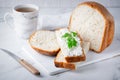 Home made bread on a wooden cutting board with curd cheese Royalty Free Stock Photo