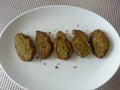 A plate of tasty and scrumptious protein rich home-made broccoli nuggets.