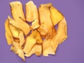 Home made cassava chips Keripik singkong with a purple background