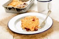 Home made cherry crumble on enamel plate