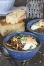 Home made chili with beans, cheese, sour cream, and cornbread.