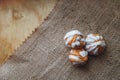 Home made choux cream on white plate. Over on wood table. Top view. with a white glaze. on wooden background. Royalty Free Stock Photo