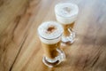 Home made coffee Cafe Macchiato on wooden table. Royalty Free Stock Photo