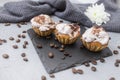 3 home made cupcakes on a black stone tile Royalty Free Stock Photo