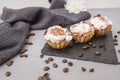 3 home made cupcakes on a black stone tile Royalty Free Stock Photo