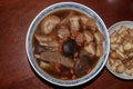 Home made delicious and tasty Bah Kut Teh pork rib soup served with stir ice salad and fried onion plus fired bread.