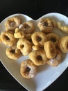 Home made donuts on heart plate Royalty Free Stock Photo