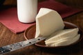 Home-made feta cheese and a bottle of milk as a raw material for the product