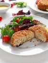 Home made Fish Cake salmon, spinach and potato. served on plate with vegetables Royalty Free Stock Photo