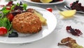 Home made Fish Cake salmon, spinach and potato. served on plate with vegetables Royalty Free Stock Photo