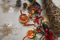 Home made garlad of natural materials - dry orange chips, ginger bread cookies, arcons, ribbons and pine cones,eco