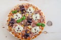 Home made Halloween pizza with ghosts and spiders