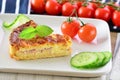 Home made ham and cheese quiche with tomatoes and cucumber Royalty Free Stock Photo