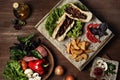 Home made hamburger with french fries, cherry tomatoes Royalty Free Stock Photo