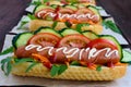 Home made hot dogs with vegetables, juicy sausage and arugula Royalty Free Stock Photo