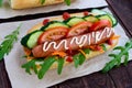 Home made hot dogs with vegetables, juicy sausage and arugula Royalty Free Stock Photo