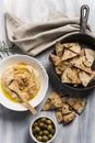 Home made humus with bread and olives