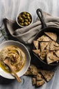 Home made humus with bread and olives