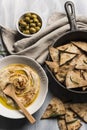 Home made humus with bread and olives