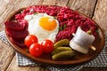 Home-made Labskaus of potato, corned beef and beet served with f Royalty Free Stock Photo