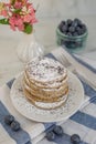 Home made lemon pancakes with poppy seeds on a breakfast table Royalty Free Stock Photo