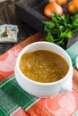 Home-made onion soup in a ceramic bowl close-up. French cuisine